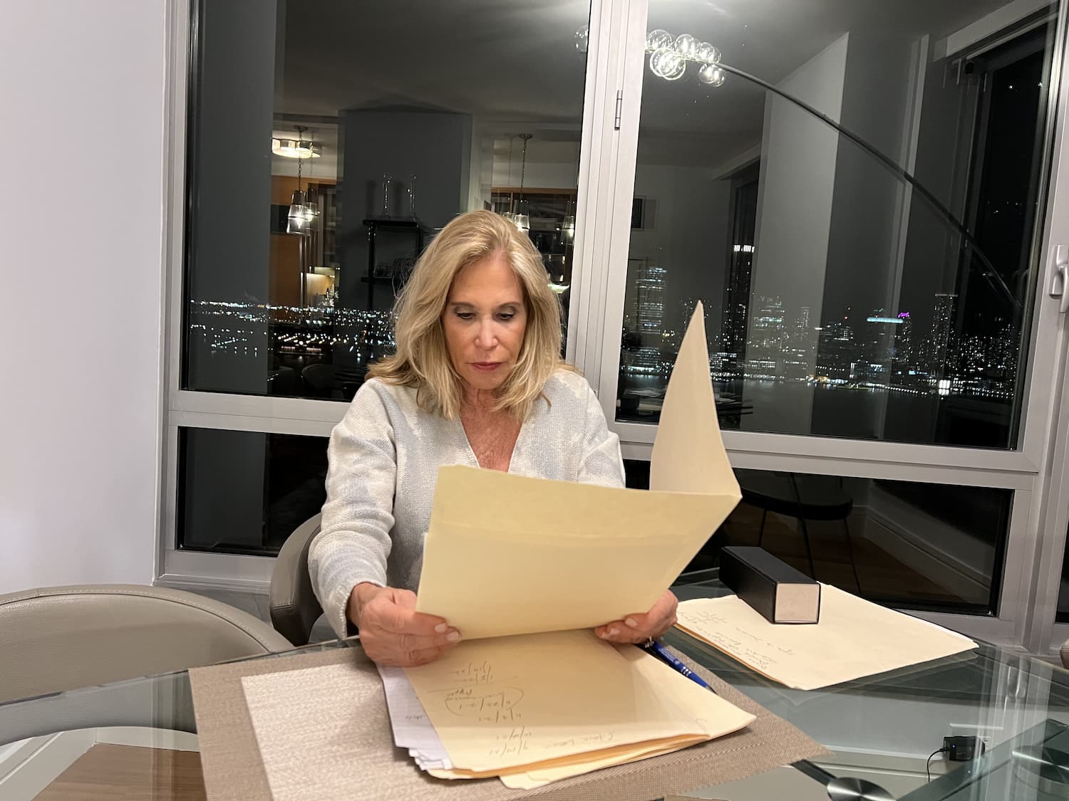 a photo of debra, looking through a folder